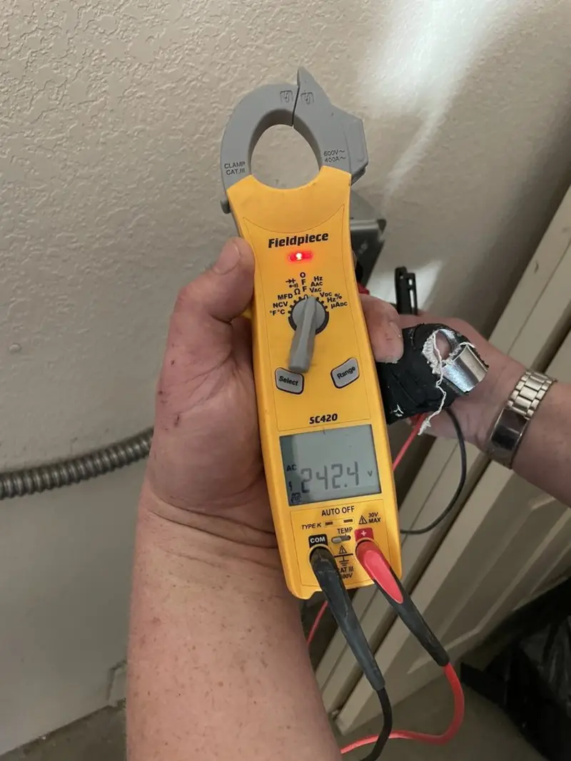 Voltage testing with clamp meter during Recessed Lighting Installation in Raleigh Hills